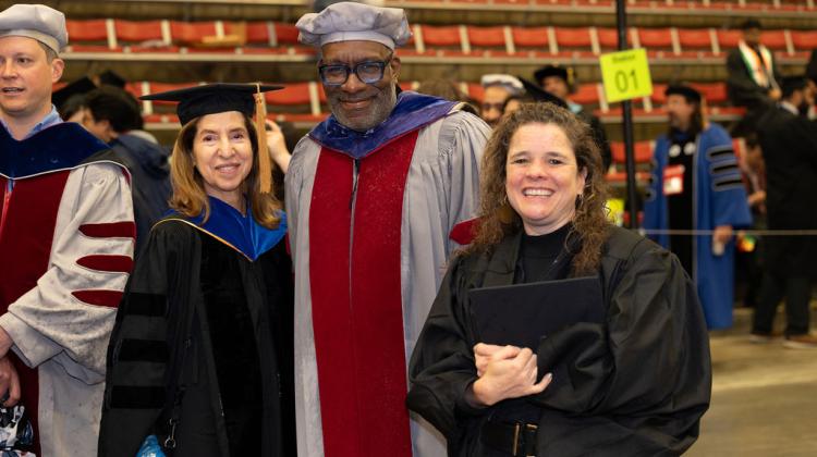 Three SA+P faculty smile for photo at procession lineup